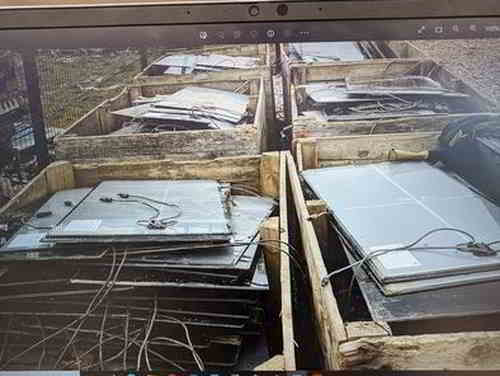 Image showing a pile of solar panels in the UK that are ready for disposal.
